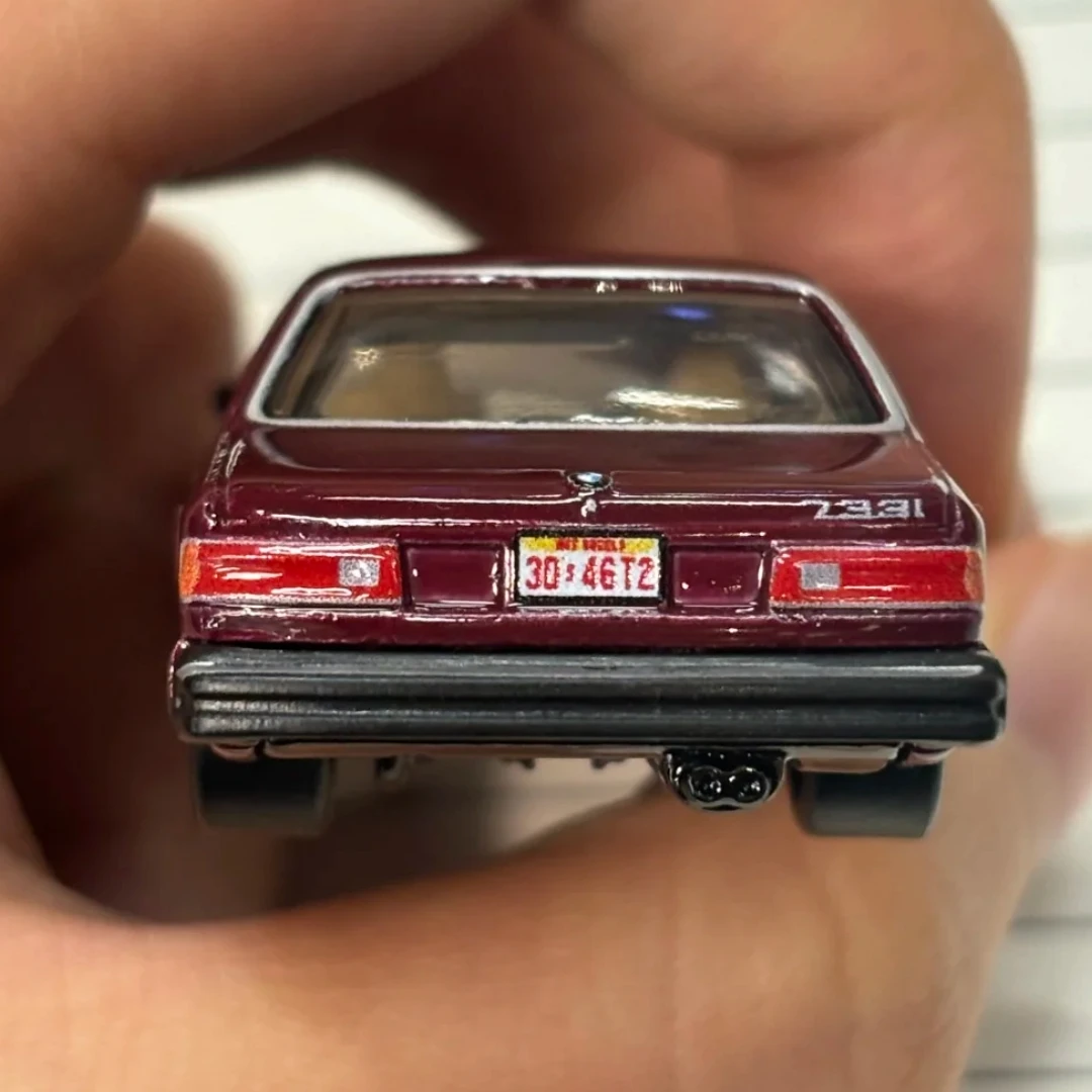 รถของเล่นสะสม โมเดลรถไดแคสต์ อัลลอยด์ ของแท้ ปี 2025 ฮอตวีลส์ พรีเมียม นิว ป๊อป คัลเจอร์ รถบีเอ็มดับเบิลยู 733i ปี 1983 ขนาด 1:64 ของขวัญ