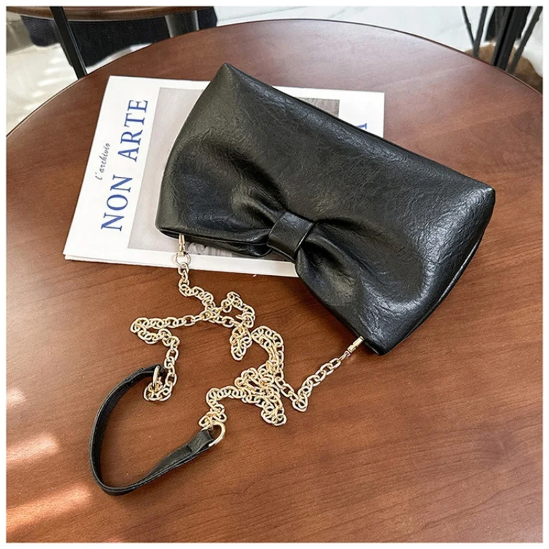 

Timeless bow-shaped chain bag with soft finish & adjustable strap, lightweight & practical for casual outings