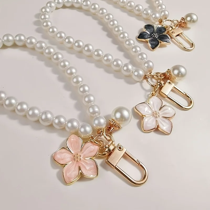 

Набор из 3 предметов: розовый, белый и черный короткие ремешки-шнурки для телефонов и сумок.