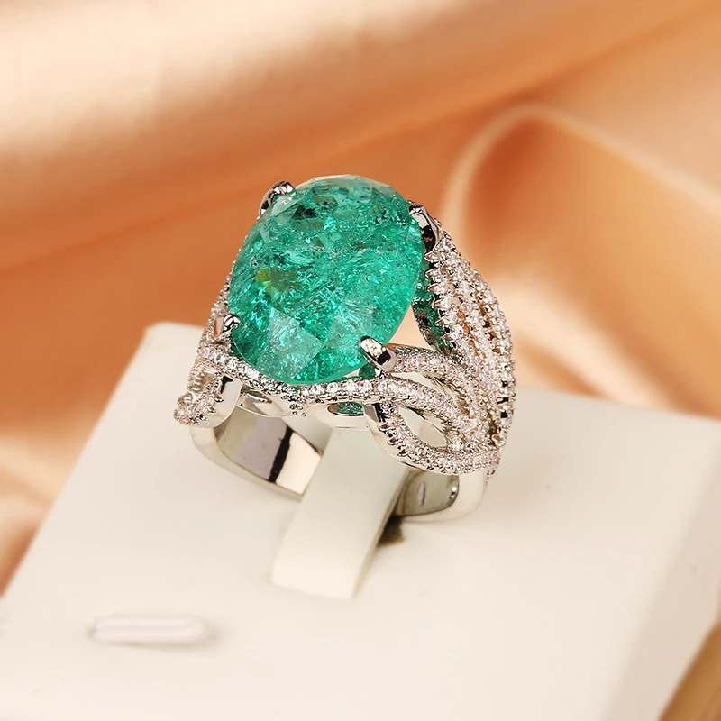 

2024 NEW Fashionable Hollow Wrap Paraiba Oval Emerald Full Diamonds Ring For Women Zircon Christmas Gift Party Jewelry