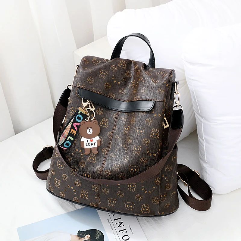 Cartoon trend bear print women backpack, texture anti-theft all-in-one travel backpack, playful bear hanging ornaments