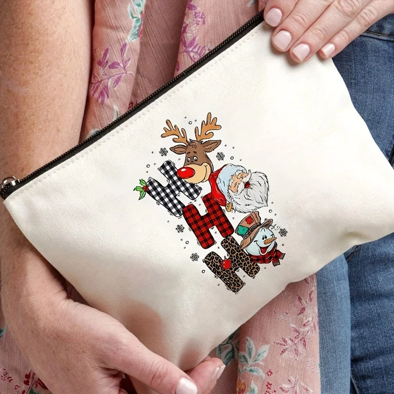 One printed withHHHChristmas-themed toiletry bag featuring Santa Claus, reindeer, and snowmen，Lightweight and durable，It has a g