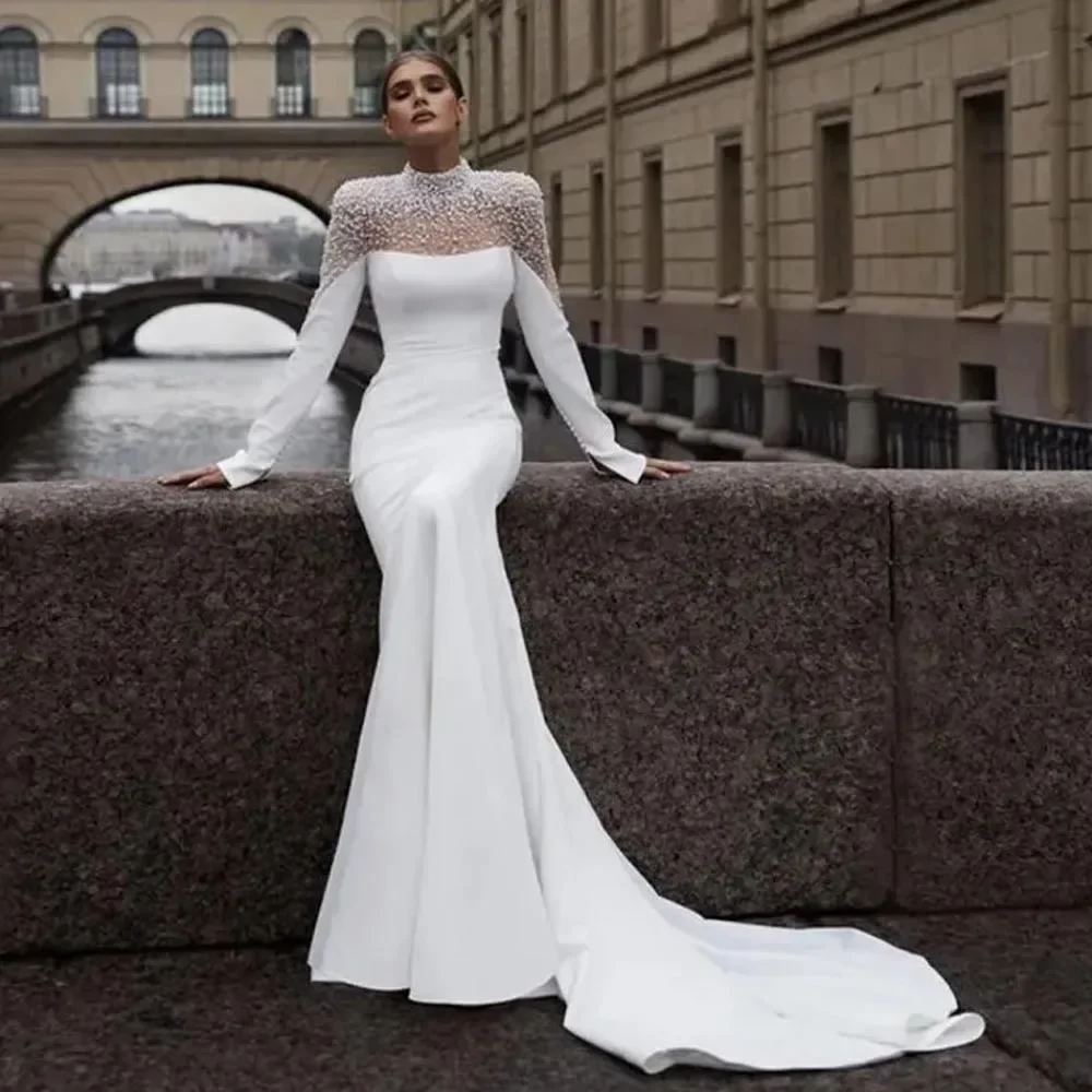 ชุดแต่งงานทรงเมอร์เมดแบบคอสูง แขนยาว ประดับมุก แบรนด์ Jane Eyre พร้อมชายกระโปรงยาวแบบสั่งตัดได้ (Vestido De Noival)