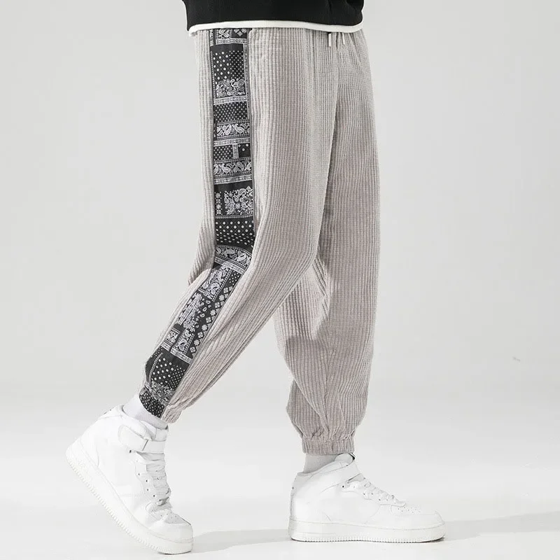 Pantalones de pana con cintura elástica para hombre, ropa de calle Harajuku, chándal informal, pantalones de retazos estampados, moda de otoño e invierno