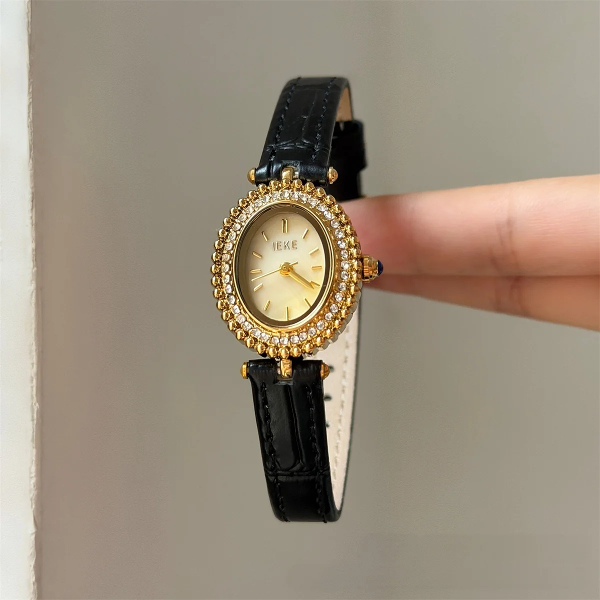 KAIRIS Women's Oval Rhinestone Watch Gold Tone Purple Dial Black Leather Strap Elegant Quartz Wristwatch for Women