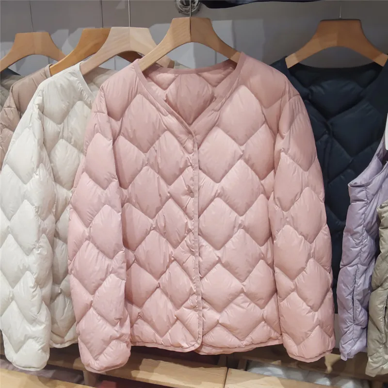 

Premium lightweight jacket. Short, sleek cut with round neck. Versatile as inner layer or standalone chic coat.