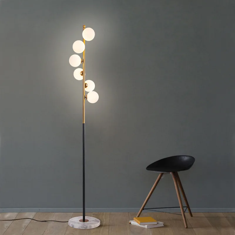 

Nordic floor lamp bedroom living room personalized creative ball wrought iron warm postmodern study simple light luxury standing