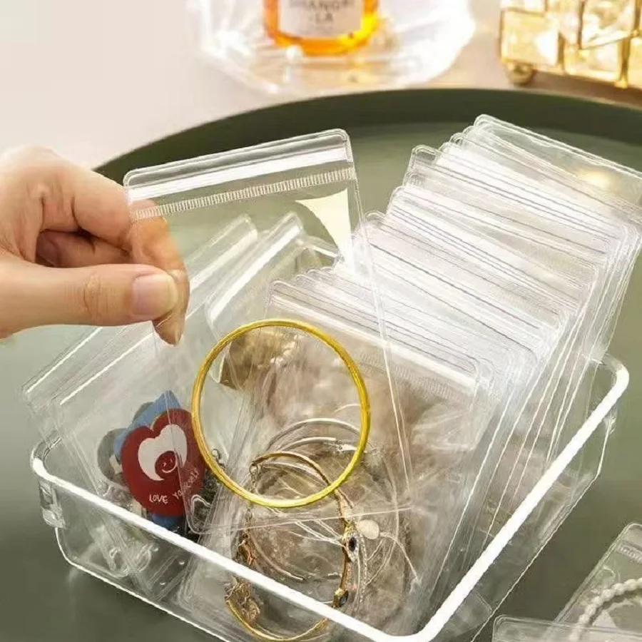 100 szt. Małe, samozamykające się, przezroczyste plastikowe woreczki z PVC do przechowywania biżuterii, bransoletek, pierścionków, kolczyków, organizer