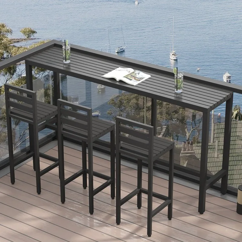 

Outdoor bar counter, plastic wood table and chair combination, open-air balcony against the wall, long strip table, outdoor anti