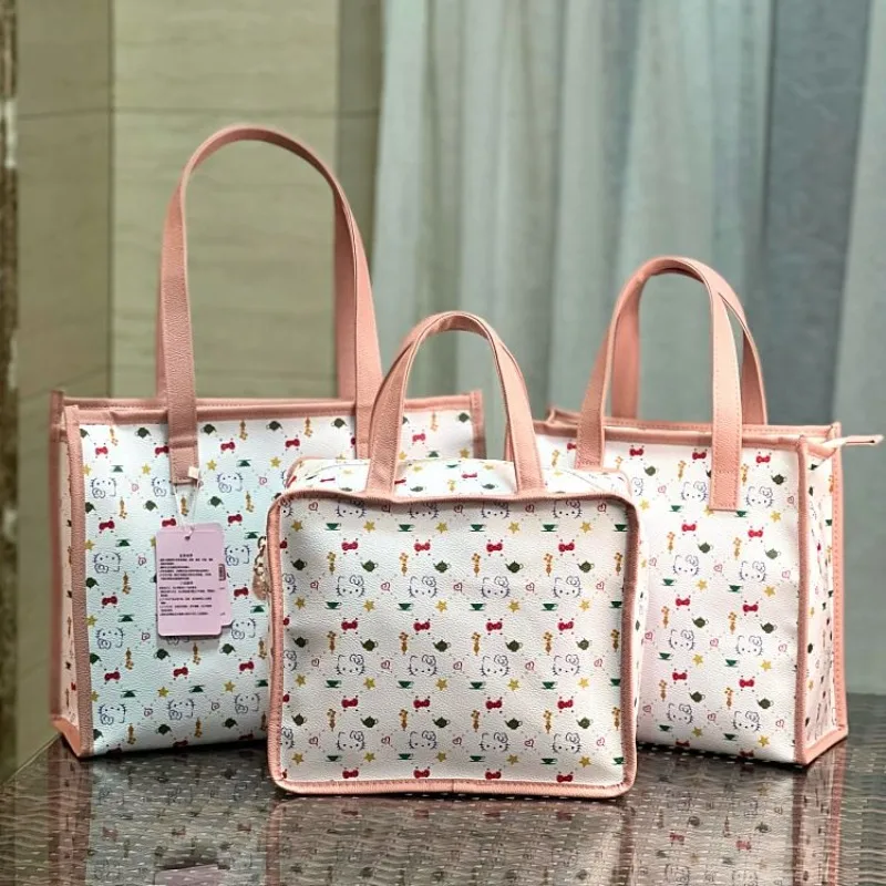 New Hello Kitty Handbag with Cute Printed Patterns Makeup and Toiletries Bag Cartoon PU for Work Hand-held Snacks Mommy Bag