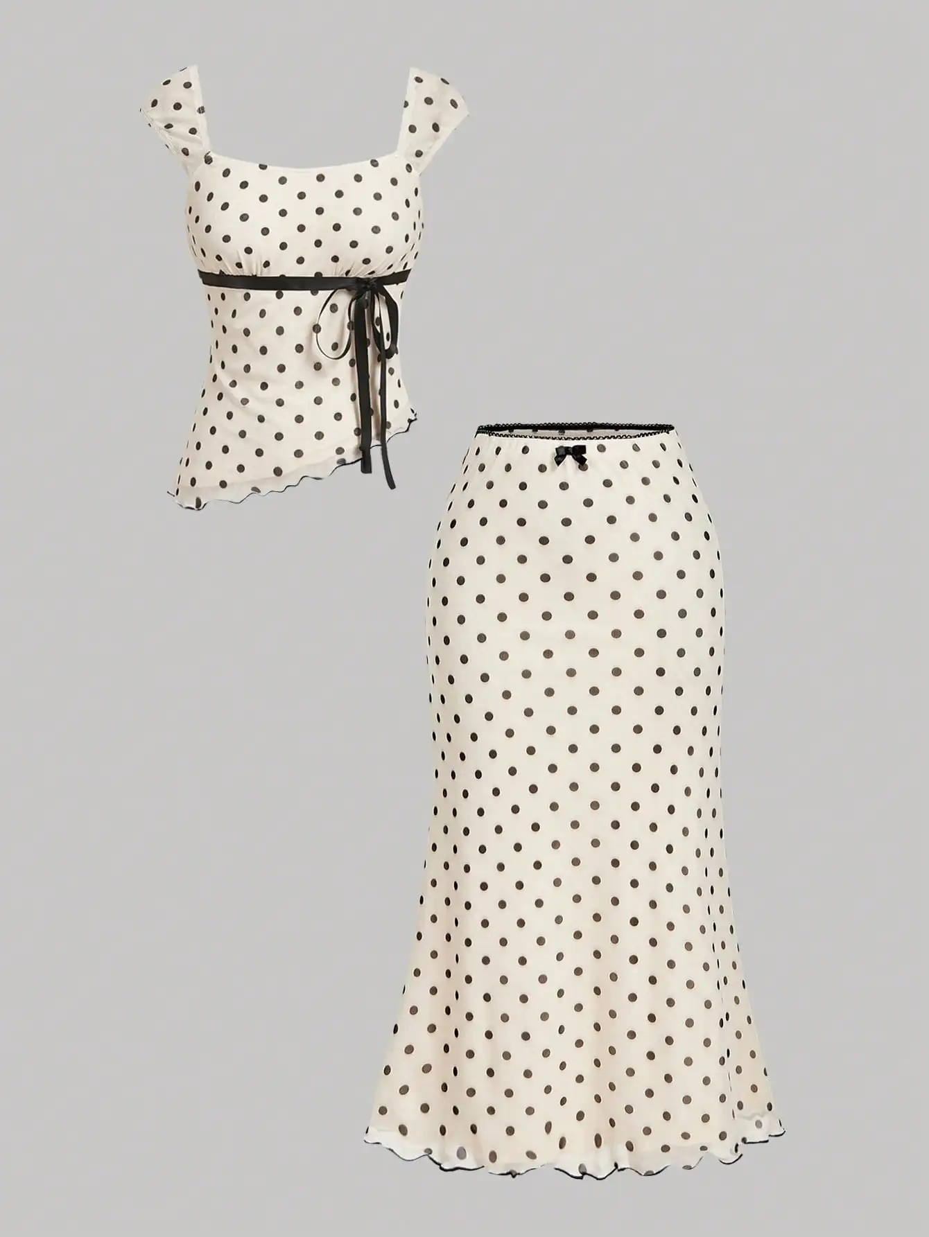 

Женский комплект из двух предметов в горошек: топ с асимметричным подолом и юбка-рыбка с бантом