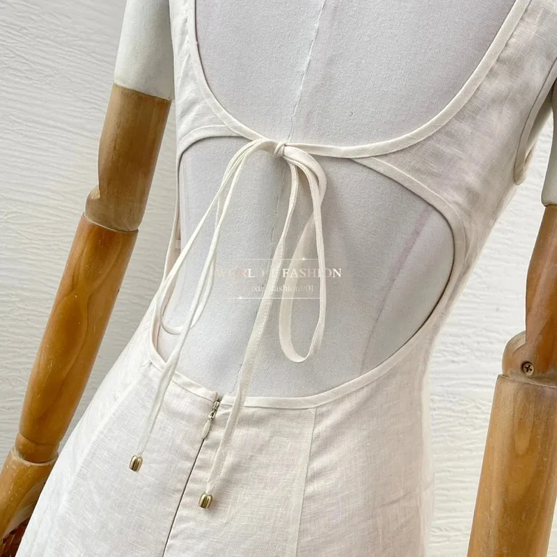 فستان ميدي نسائي من الكتان النقي 2025 بتصميم شاطئ جديد أبيض بدون أكمام مطبوع عليه زهور ورباط بدون ظهر