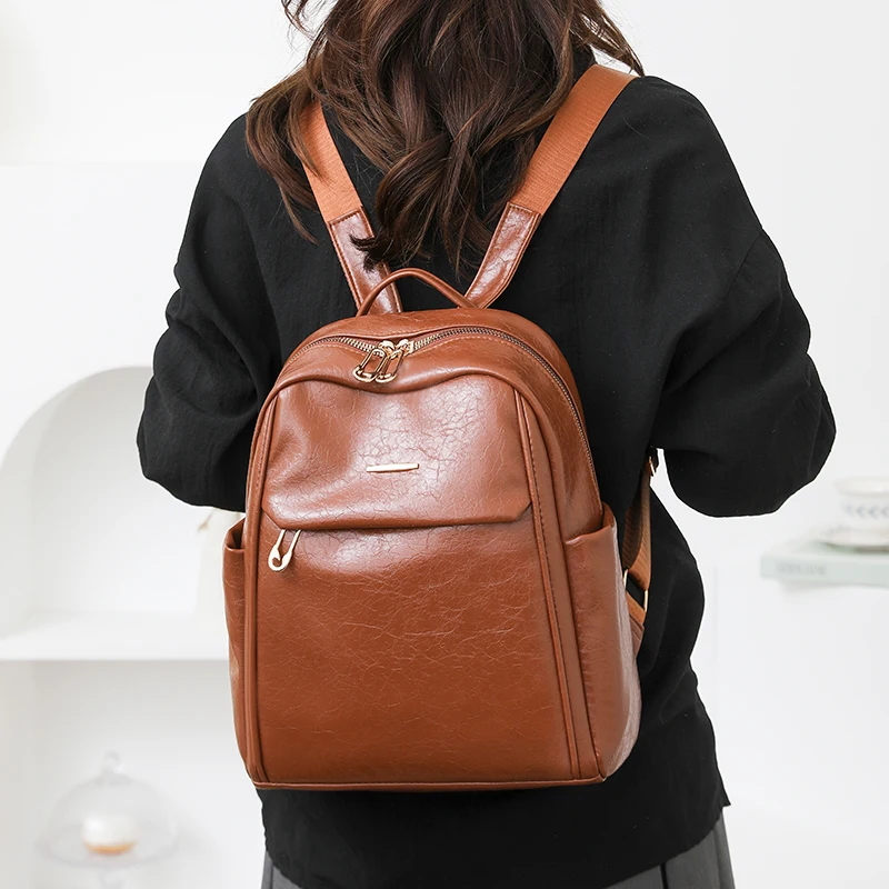 スタイリッシュな Pu レザー女性のバックパック大容量盗難防止ラップトップバッグ大学スクールバッグ旅行リュックサック女性のバックパック