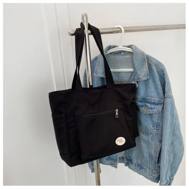 المرأة حقيبة كتف الموضة فئة سعة كبيرة طالب حمل حقيبة 2025 جديد قماش ركاب حمل حقيبة حقيبة نسائية