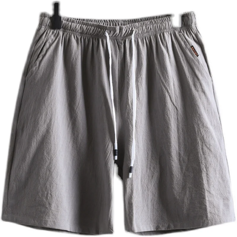 شورت صيفي قطني كتان للرجال شورت فضفاض مرن عصري 5 نقاط سروال مستقيم الساق نمط رياضي منتصف الخصر ملابس شبابية
