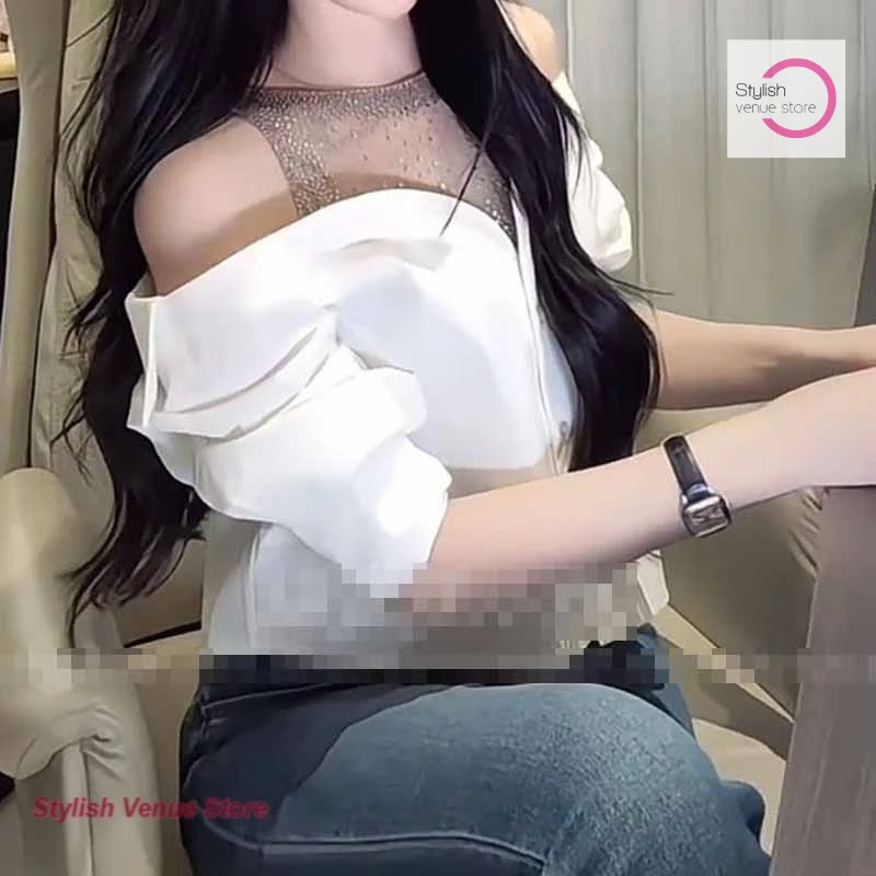 

Korean advanced rhinestone mesh stitching fake two-piece blouse women's spring and autumn new off-the-shoulder Joker shirt
