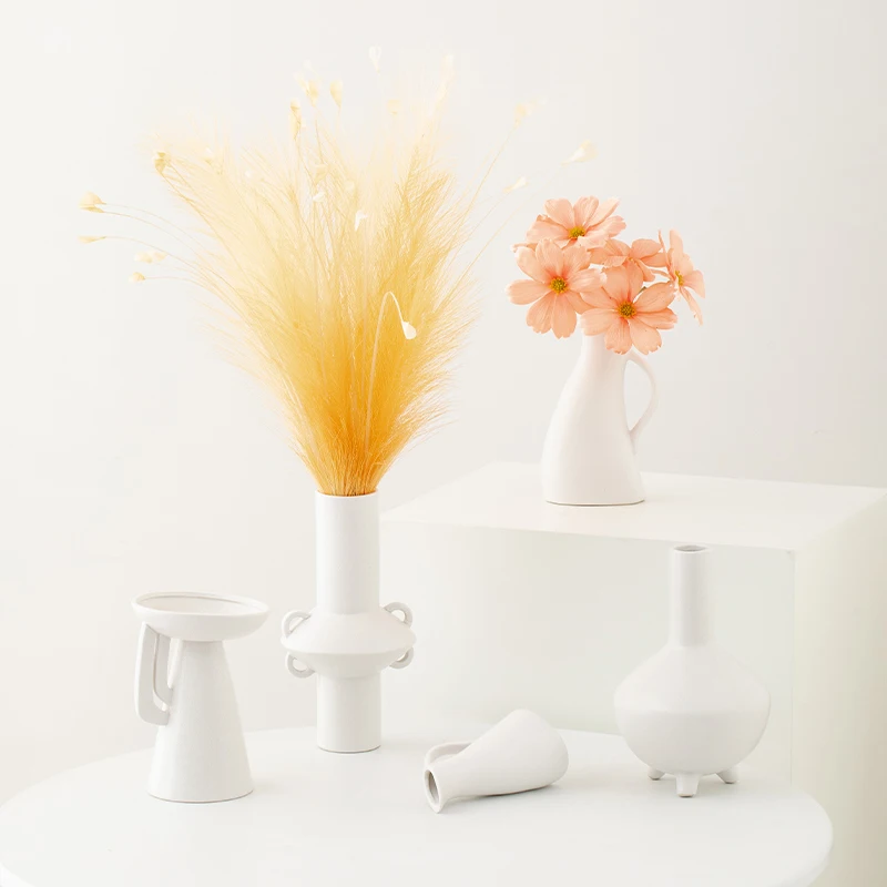 

Ceramic vase with minimalist style, creative design, white color, luxurious and high-end feel