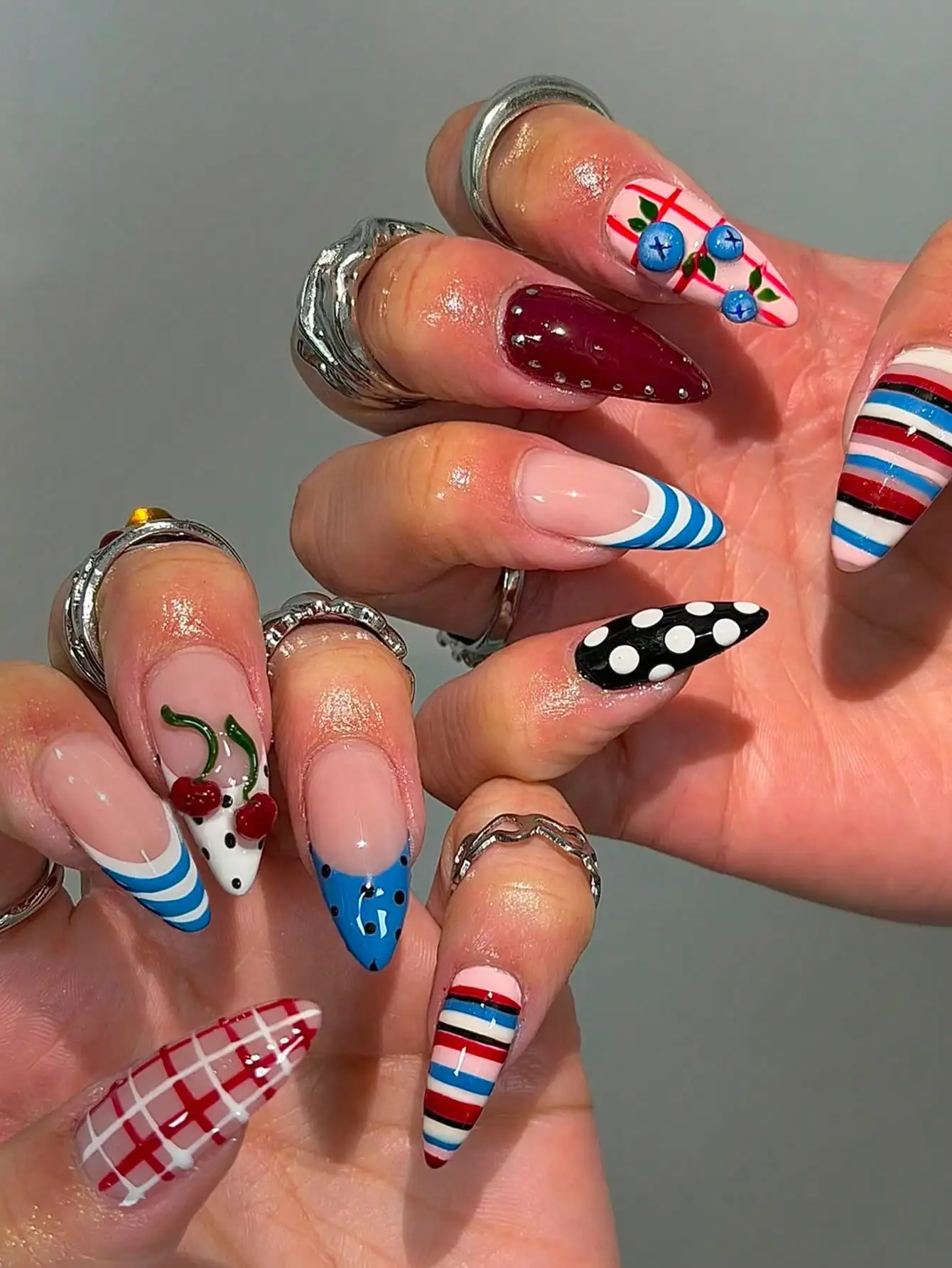 

24-Piece Retro Color Blocked Almond Press On Nails Acrylic Design Incorporating Elements Such As Polka Dots, Stripes, 3D Cherries, And Blueberries.Creates A Unique And French Tip Fake Nails That Effectively Lengthens Finger Lines.