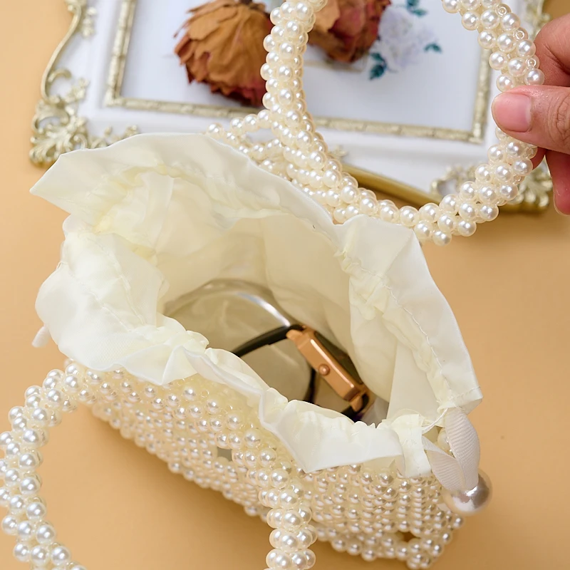 New pearl women\'s bag hand-beaded finished fashion catwalk women\'s cross-body bag light luxury texture net red mobile phone bag