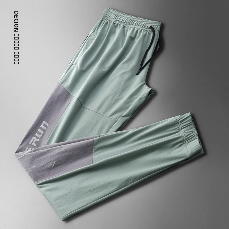 

Decion Ice Silk Тонкие летние мужские повседневные брюки Ультратонкие спортивные брюки Qui-Dry Faionable Ci Sle Свободный крой