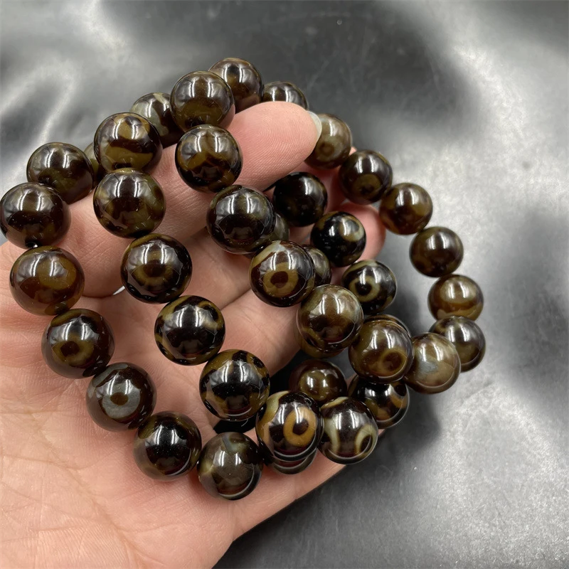 

Винтажный браслет в тибетском стиле с круглыми бусинами из агата дзи с тремя отверстиями, 14 мм.