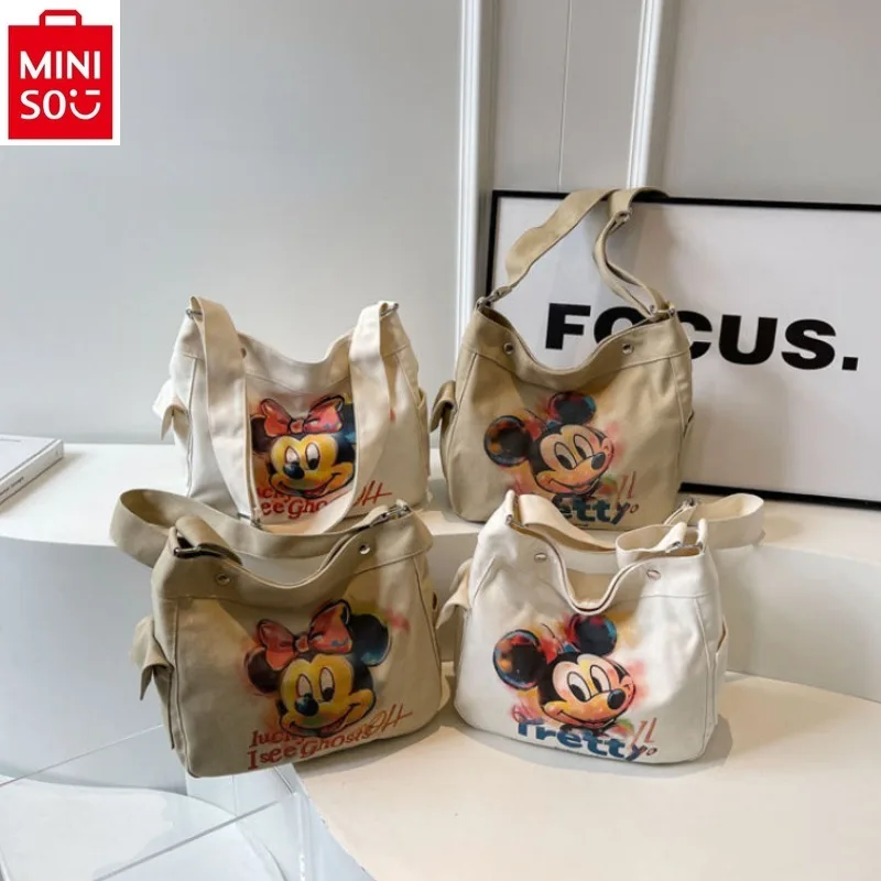 

MINISO Disney Mickey Minnie cartoon student tote bag for women's high-quality canvas casual versatile storage crossbody bag