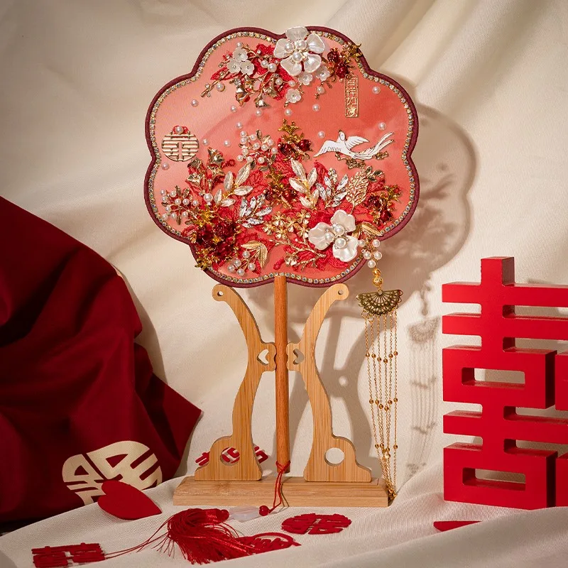 

Traditional Chinese style wedding hand holding Xiuhe fan, red double-sided joy fan finished product