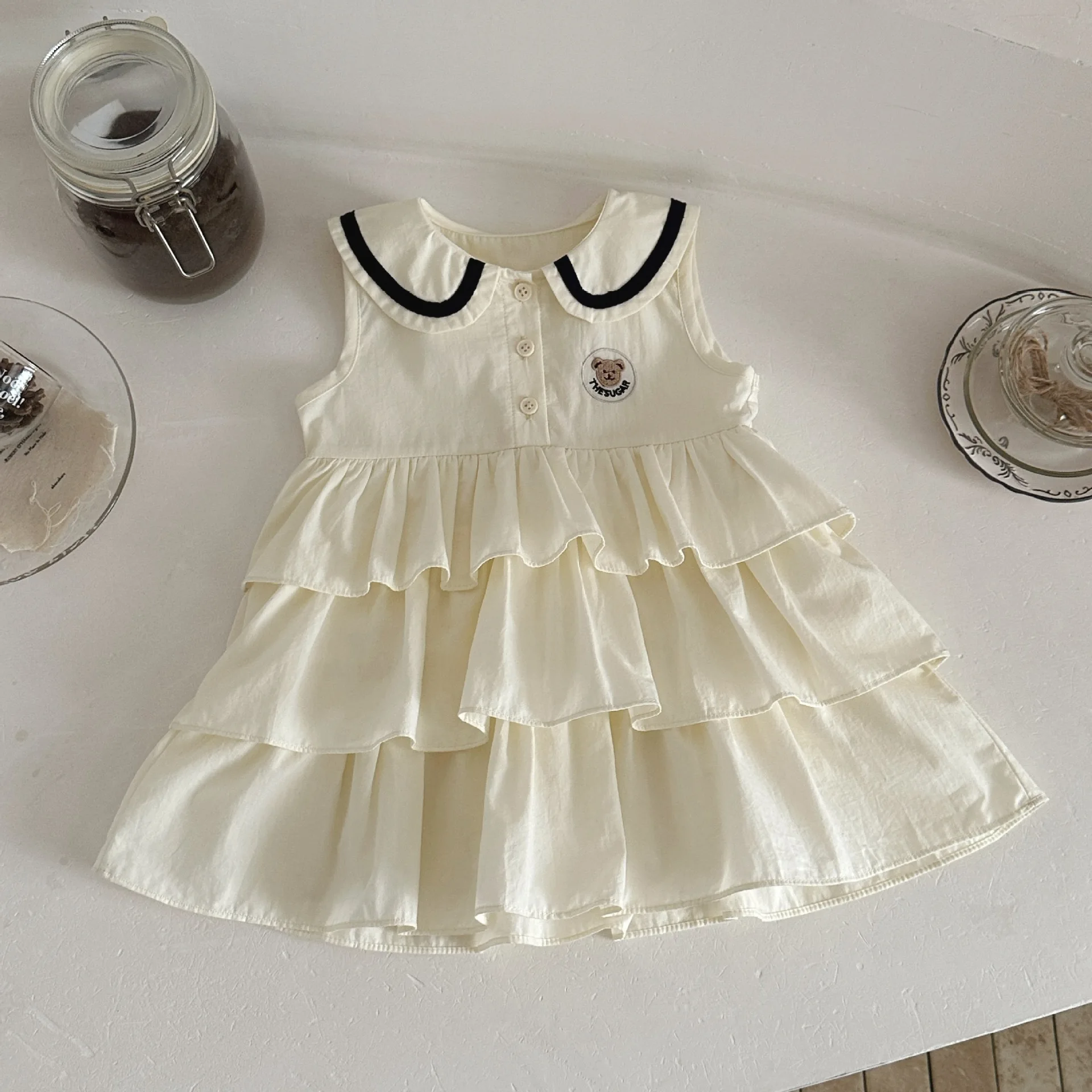 

2026 Summer New Baby Girl Sleeveless Dress Cute Lapel Infant Preppy Style Bear Tiered Dress Cotton Girls Sweet Princess Dress