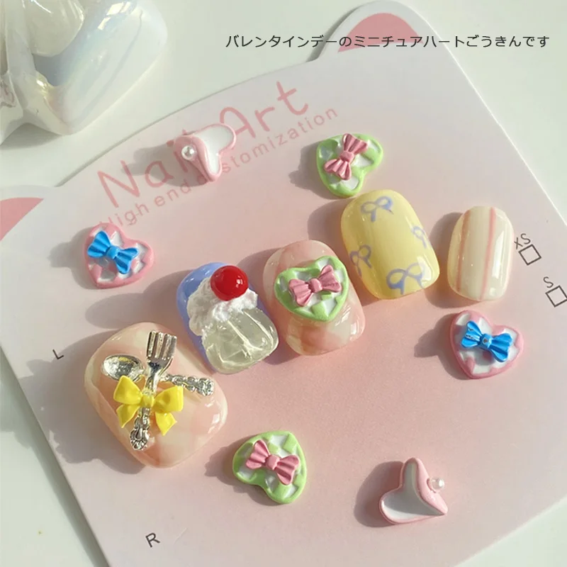 TSZS 10 ชิ้น/ล็อตที่มีสีสัน Kawaii Heart Bow Nail Art Charm เกาหลีญี่ปุ่น 3D น่ารักรักริบบิ้นเล็บตกแต่ง