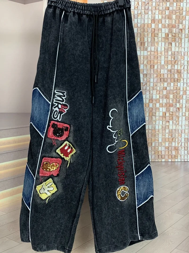 Trendige Marken-Jeans im amerikanischen Stil für Frühling/Sommer: Schwerer Patchwork-Farbblock mit Cartoon-Motiven, gerade geschnitten, schlank machend, lässige lange Denim-Hose