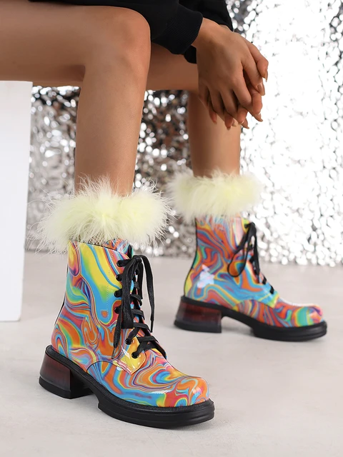 Patent leather combat boots with heel outlet