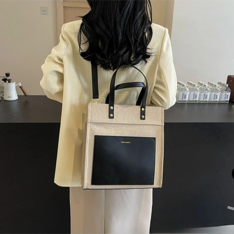 

Large capacity splicing canvas bag female 2025 new popular simple crossbody bag fashion casual commuting shoulder bags