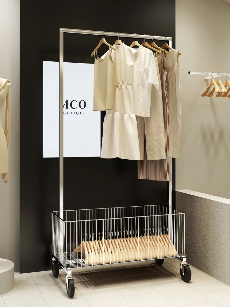 

Floor standing metal movable clothes rack display rack in clothing store, minimalist