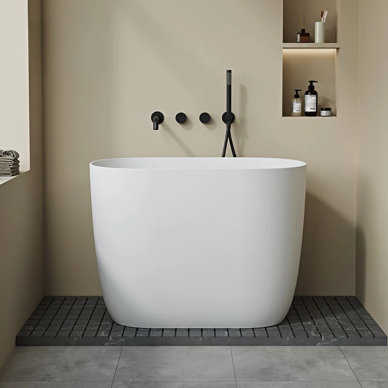

Small apartment deep soaking bathtub independent household seated artificial stone bath mini