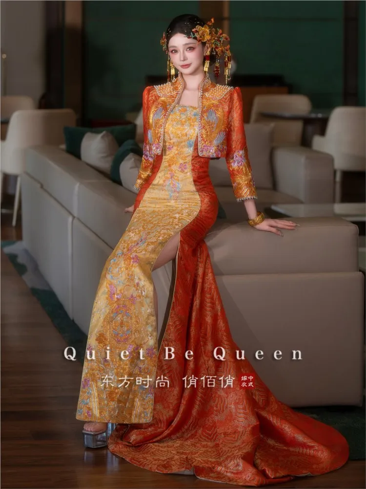 Orange cheongsam with a trailing Chinese wedding dress traditional style and elegant toasting