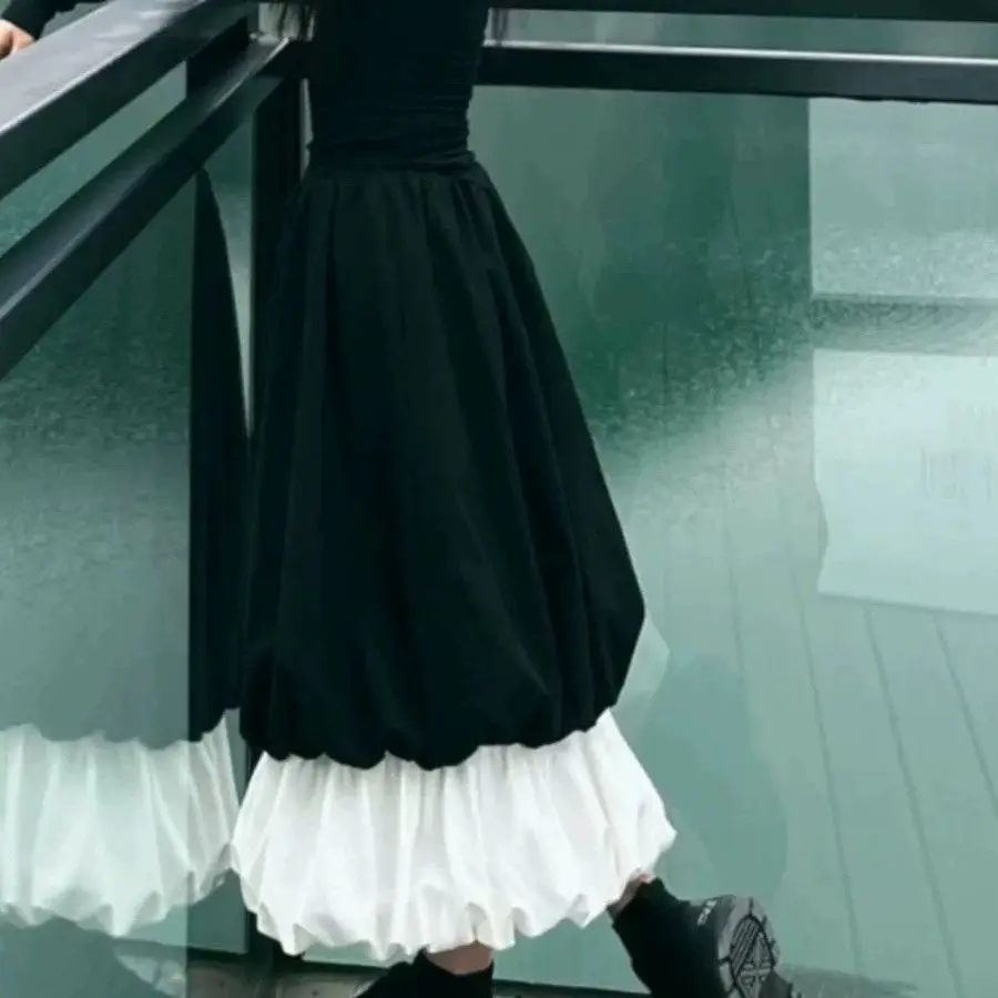 

bud pleated a word fluffy skirt autumn and winter new niche design sense black and white color matching cloud skirt