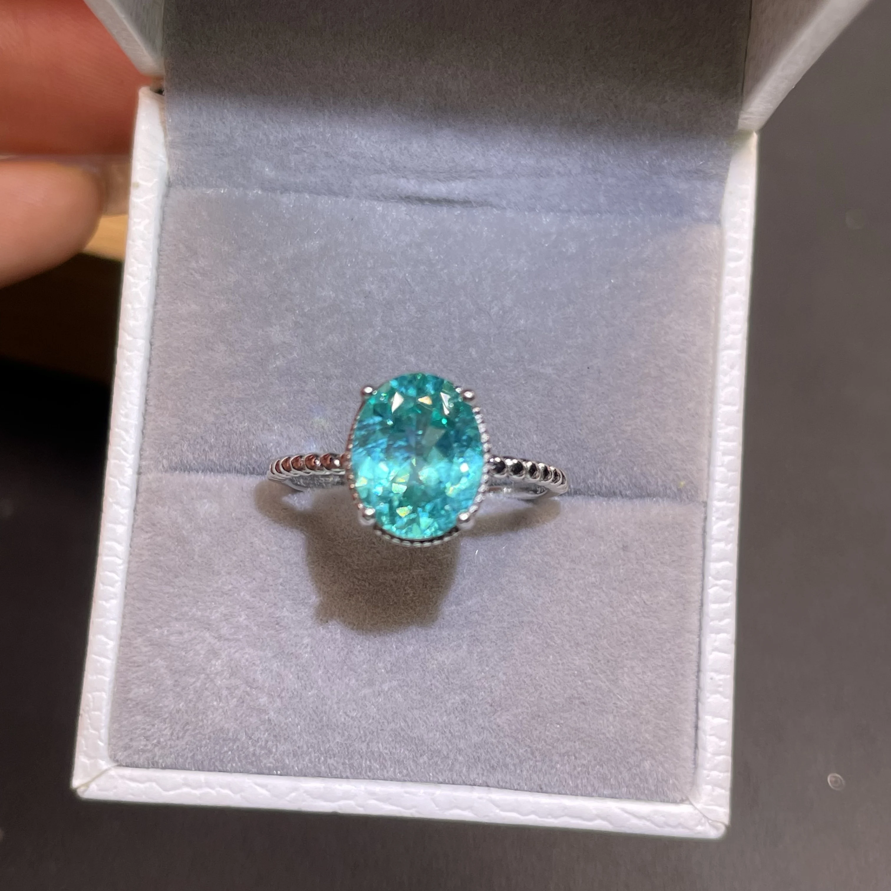 Simple Paraiba single gemstone ring. Wedding and engagement ring designed for women. Silver jewelry with adjustable design