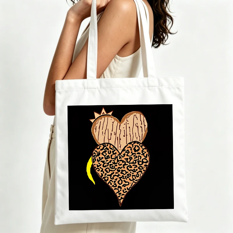 Women's heart print canvas tote bag with crown graphic, ideal for casual daily use and weekend outings
