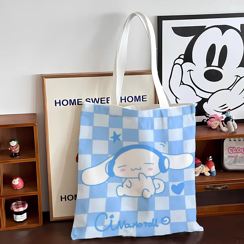 SANRIO Cinnamoroll การ์ตูนกระเป๋าสะพายไหล่กลางแจ้ง Kawaii ถุงกระเป๋าผ้าใบกระเป๋าใส่เหรียญที่เก็บขนมขบเคี้ยวของเล่นของขวัญสาว