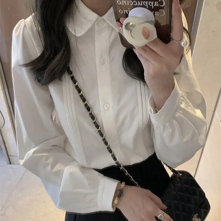 ตุ๊กตาคอหลวมเสื้อสีขาวผู้หญิงฤดูใบไม้ผลิฤดูใบไม้ร่วงลําลองหลวมเสื้อสีขาวสําหรับผู้หญิงผ้าฝ้ายเสื้อแขนยาว C1023