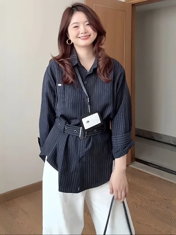 

Женский топ больших размеров в корейском стиле, приталенный, длинный рукав, в полоску, с застежкой на пуговицы, для осеннего модного образа, стройнящий...