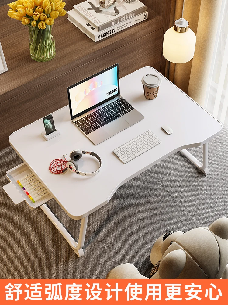 Small writing table, laptop, lazy table, student sitting on the floor, folding study desk