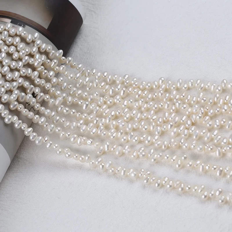 

Hot selling 4-4.5mm freshwater natural white pearl rice shape genuine pearls top drilled hole strands wholesale