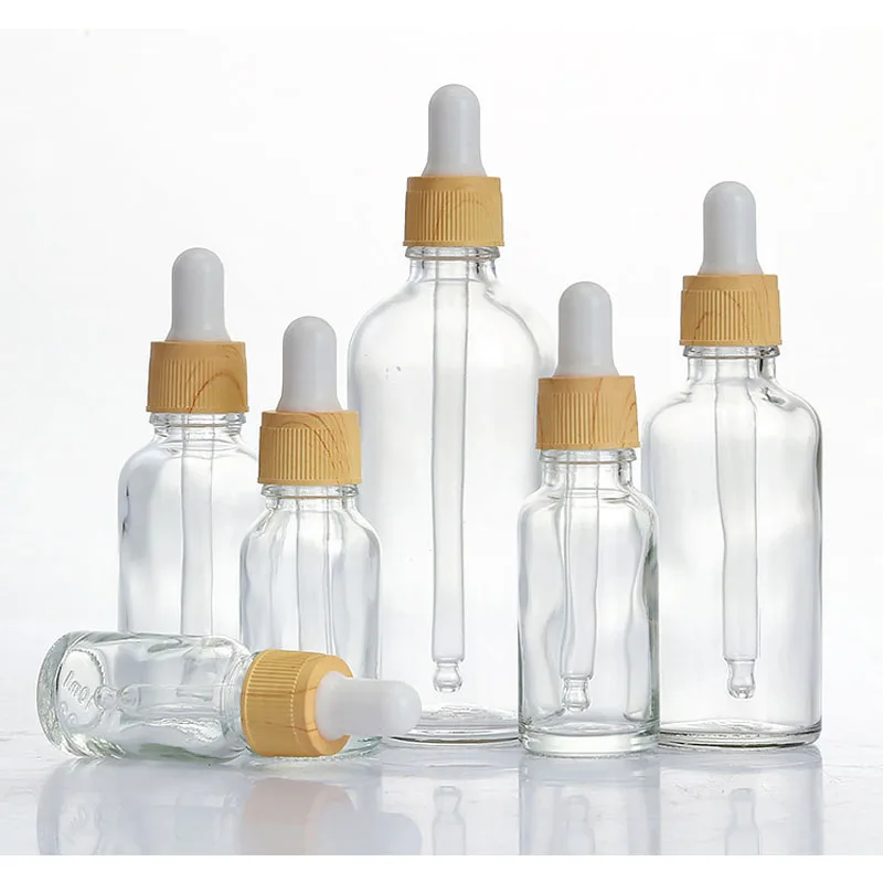 

10PCS 5ml 10ml 15ml 30ml 50ml 100ml Clear Glass Dropper Bottles wood grain lids Refillable Pipette Clear Essential Oil Bottle