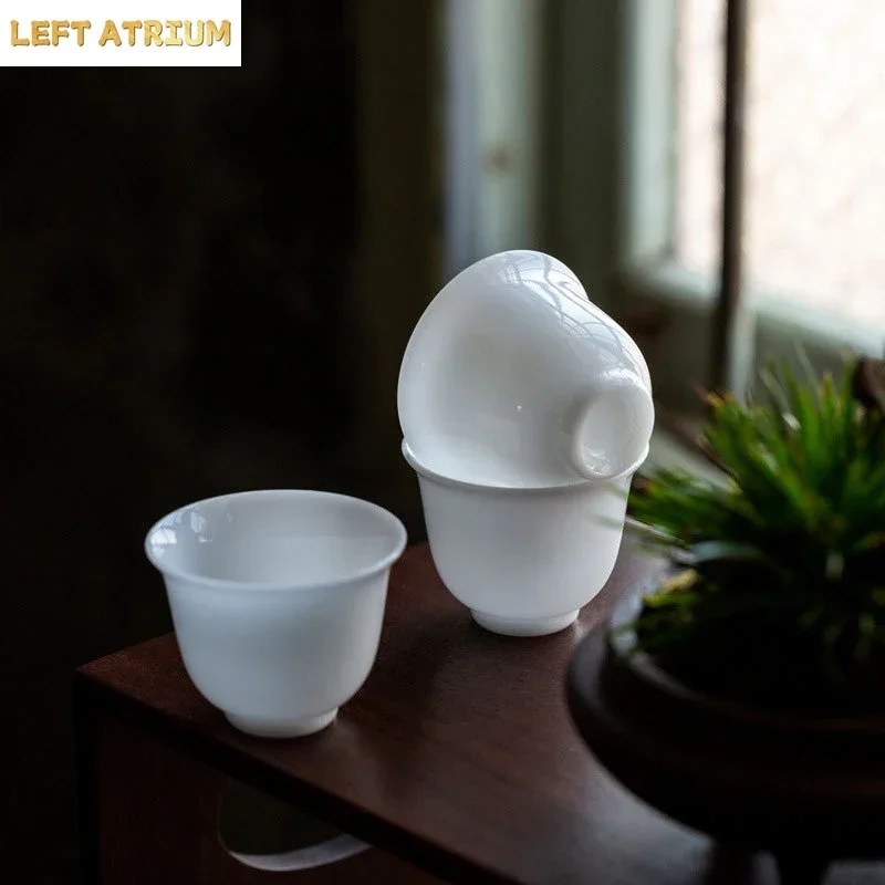 Taza de Magnolia exquisita de porcelana de Jade helado de 80ml, porcelana de Jade gorda de oveja, taza de té china de Kung Fu, juego de tazas de té de alta calidad