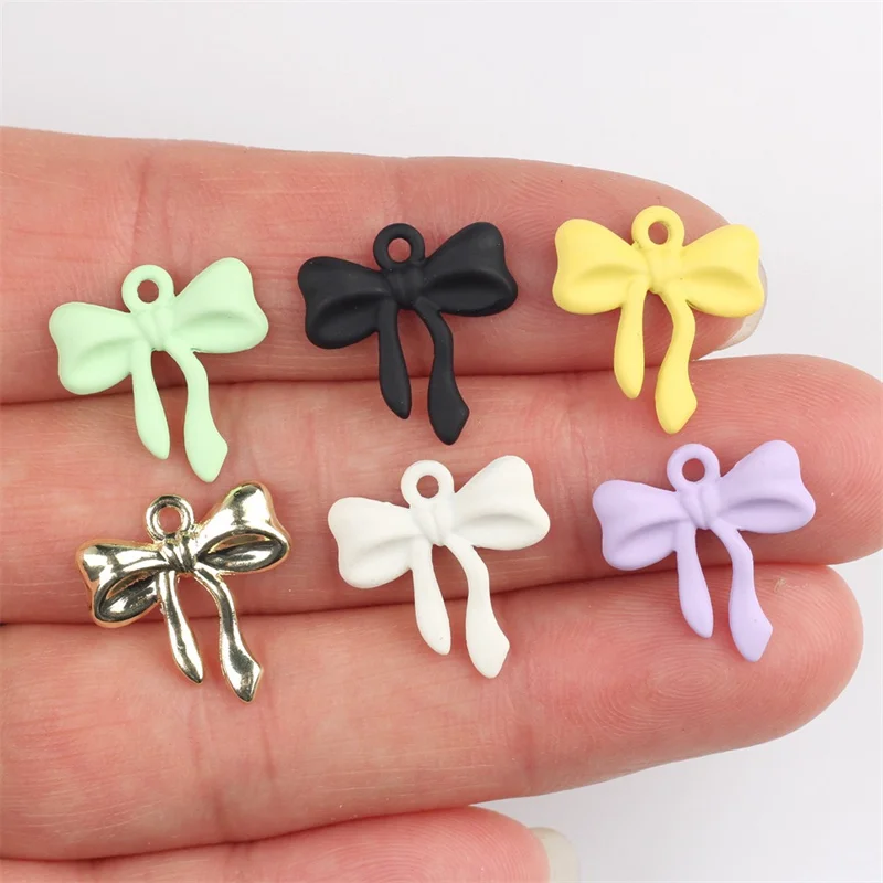 

2025 Newest 50pcs/lot color Rubber paint cartoon bowknot shape alloy floating locket charms diy jewelry accessory
