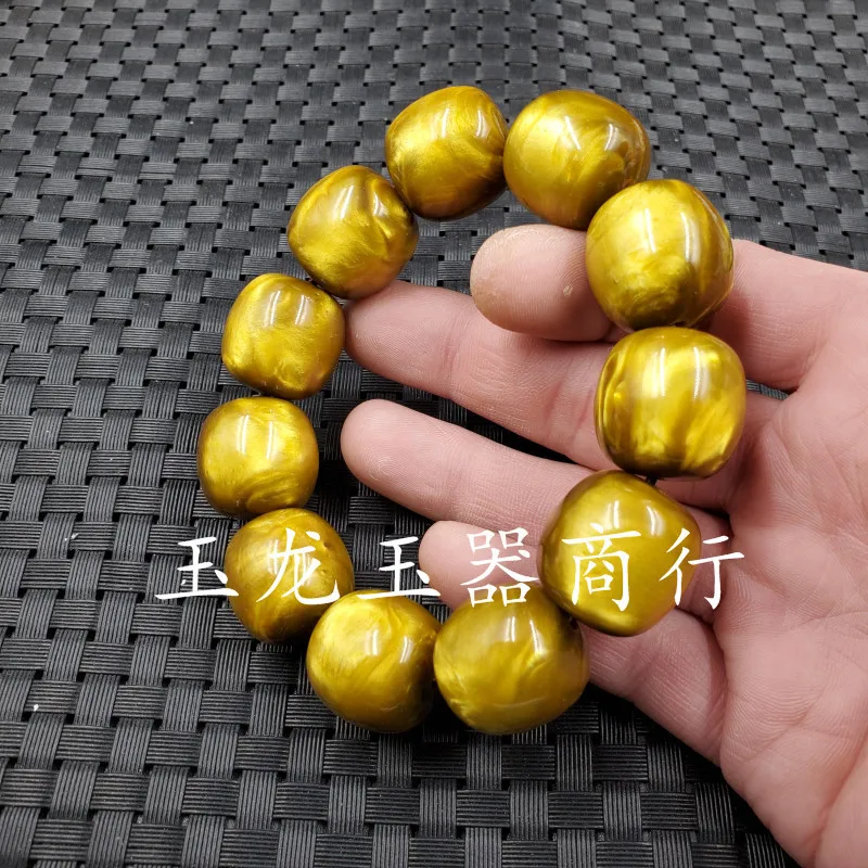 Jade and artificial amber barrel bead , gold thread sea willow lucky charm , jewelry bracelet, hand chain