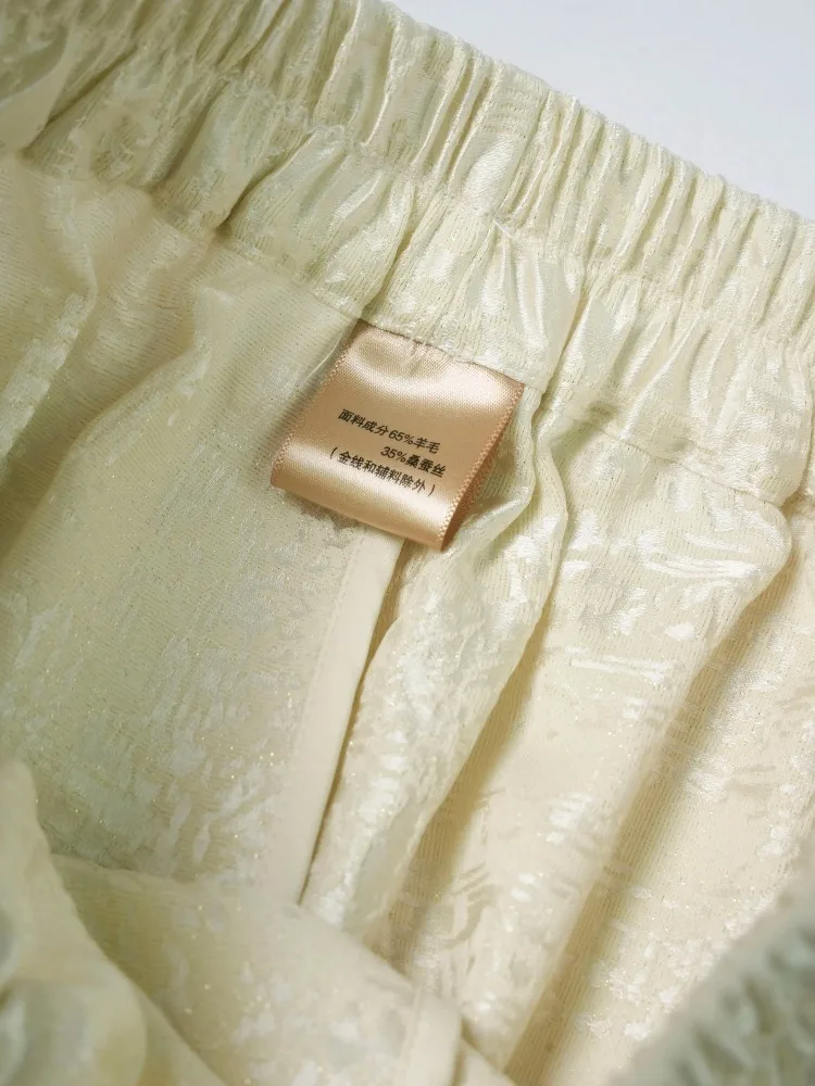 Damskie spodnie z elastyczną talią, uniwersalne, codzienne, do kolan, wykonane z 35% naturalnego jedwabiu morwowego i 65% wełny, w jednolitym kolorze.