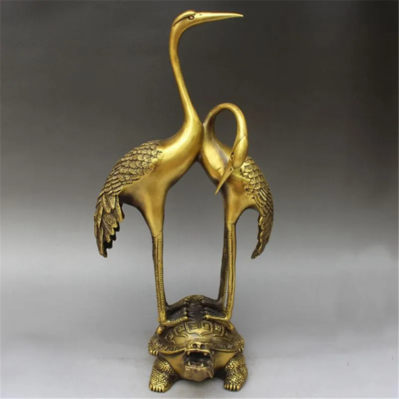 Brass ornaments featuring a stepping on a dragon and a double crane turtle