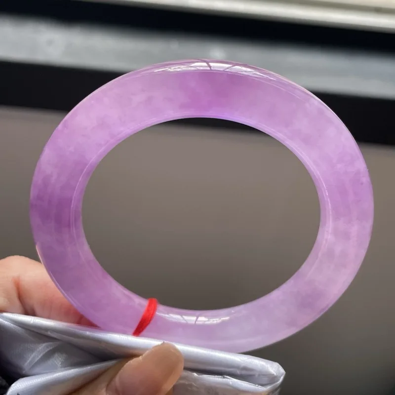 bracelet with a perfect, ice-like translucency, featuring a violet-colored jade stone in a round, circular design